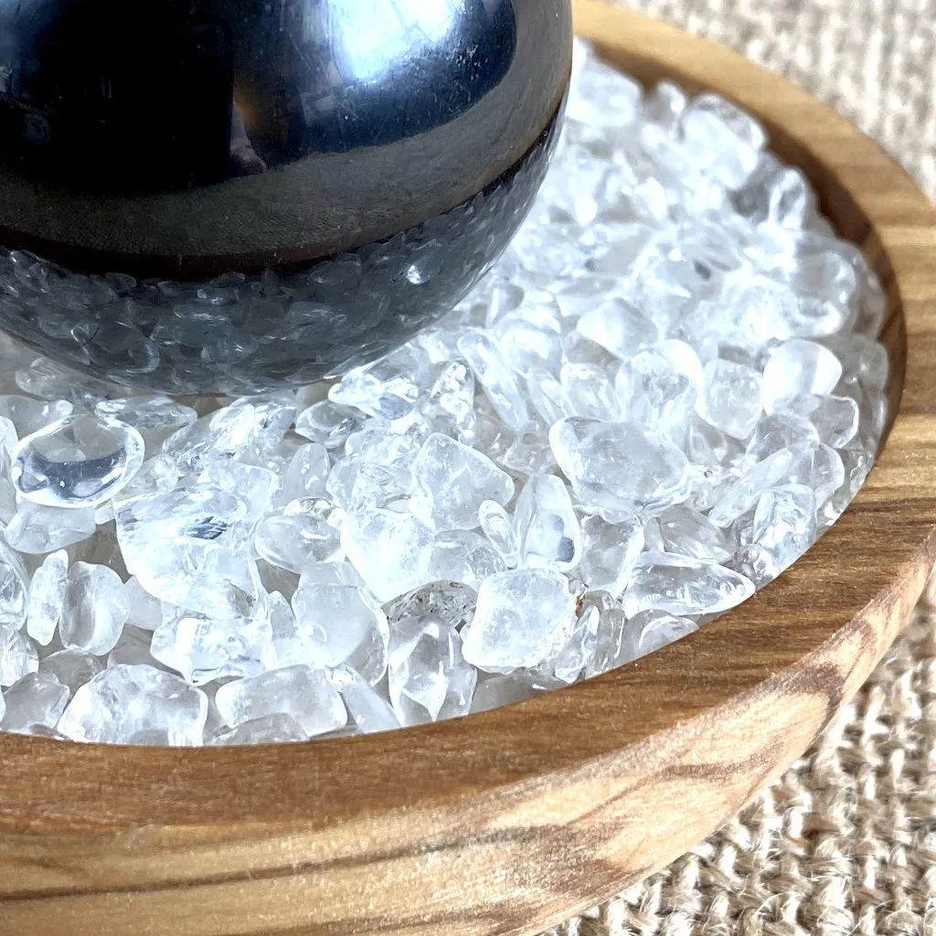 Shungite Sphere on Bed of Microtumbled Crystal in Olive Wood Bowl